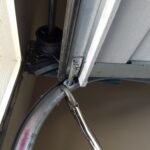 Lock garage door in open position with vice grip