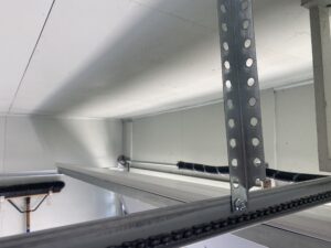 Linear garage door opener rail with additional support